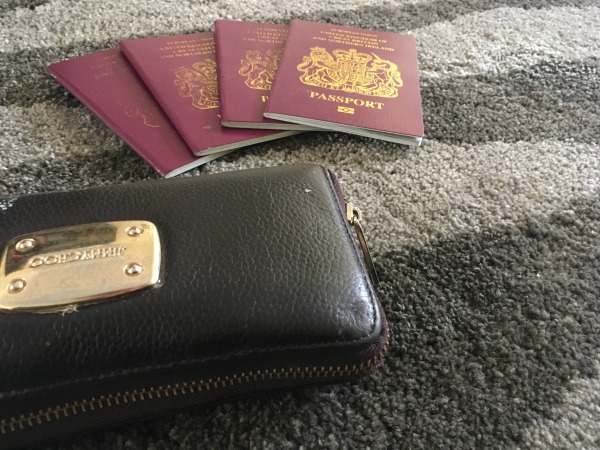 passports and credit card hand luggage on a long haul night flight with children